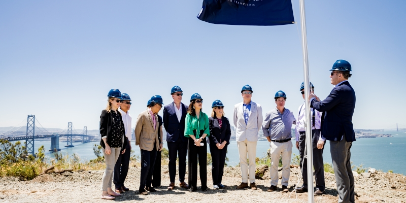breaking ground ceremony overlooking san francisco skyline with blue ocean water and an array of people