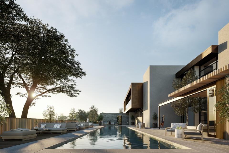 modern club house in neutral, organic tones and shapes with a lap swimming pool, cushy seating and copper details