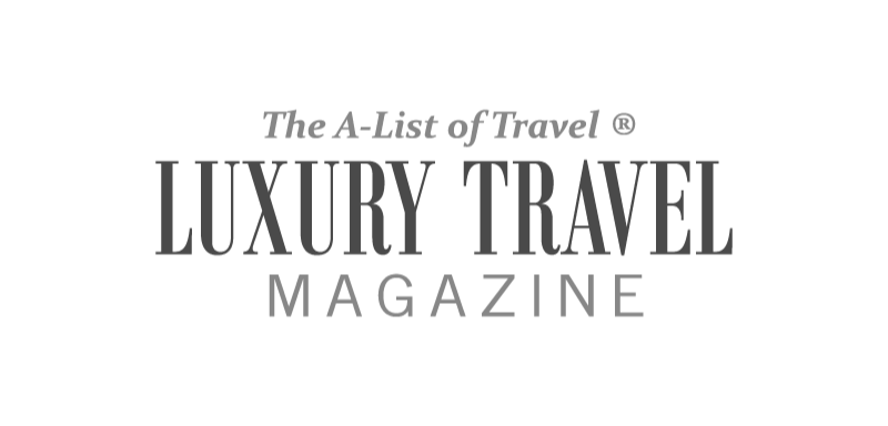 magazine logo spells out luxury travel magazine in a mixed serif and san serif composition in grey scale